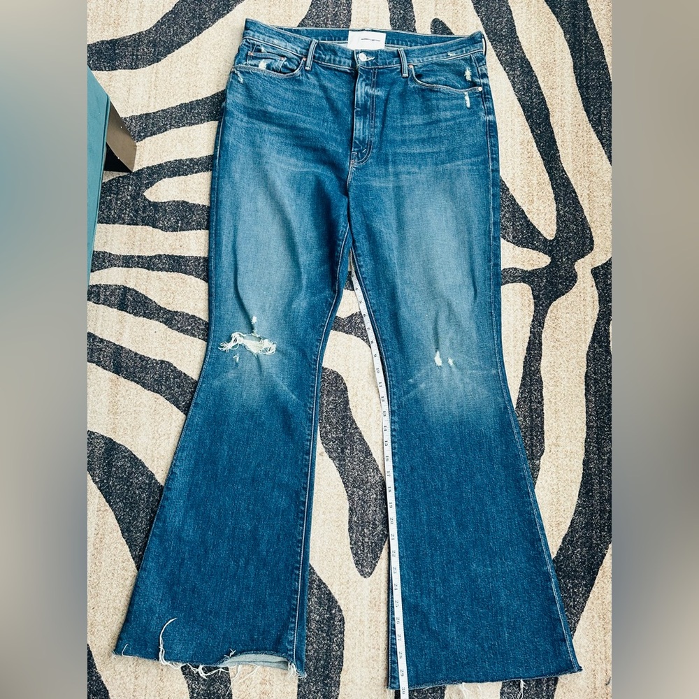 Mother Denim Born to Bite Flare Jeans, light distressing and a raw hem.